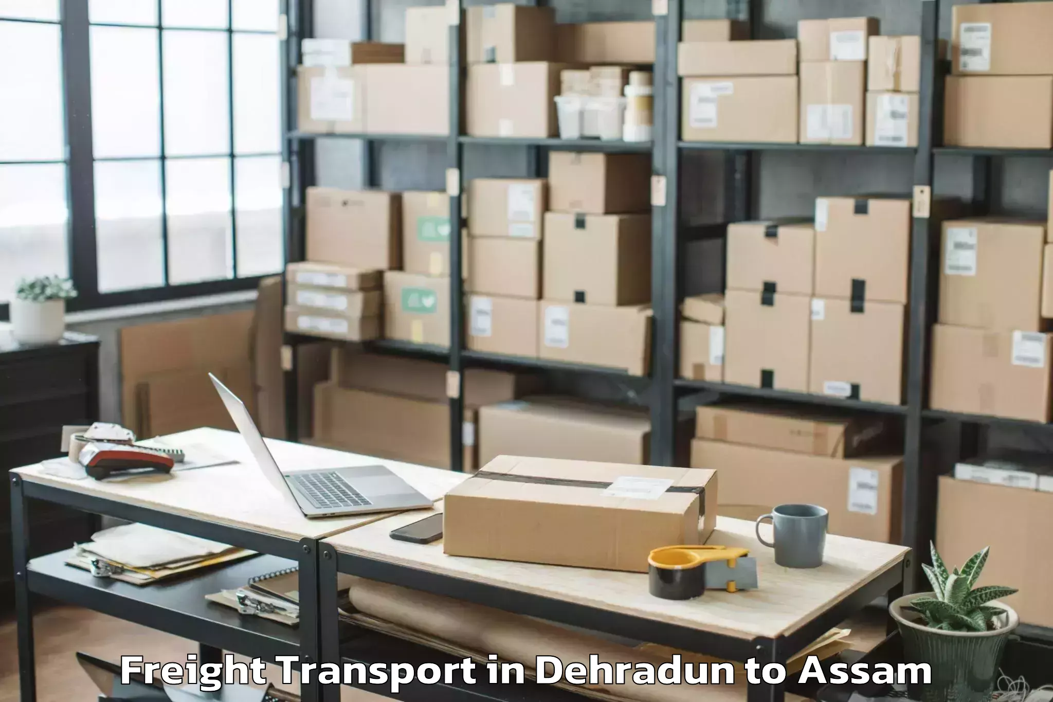 Book Dehradun to Mankachar Freight Transport Online